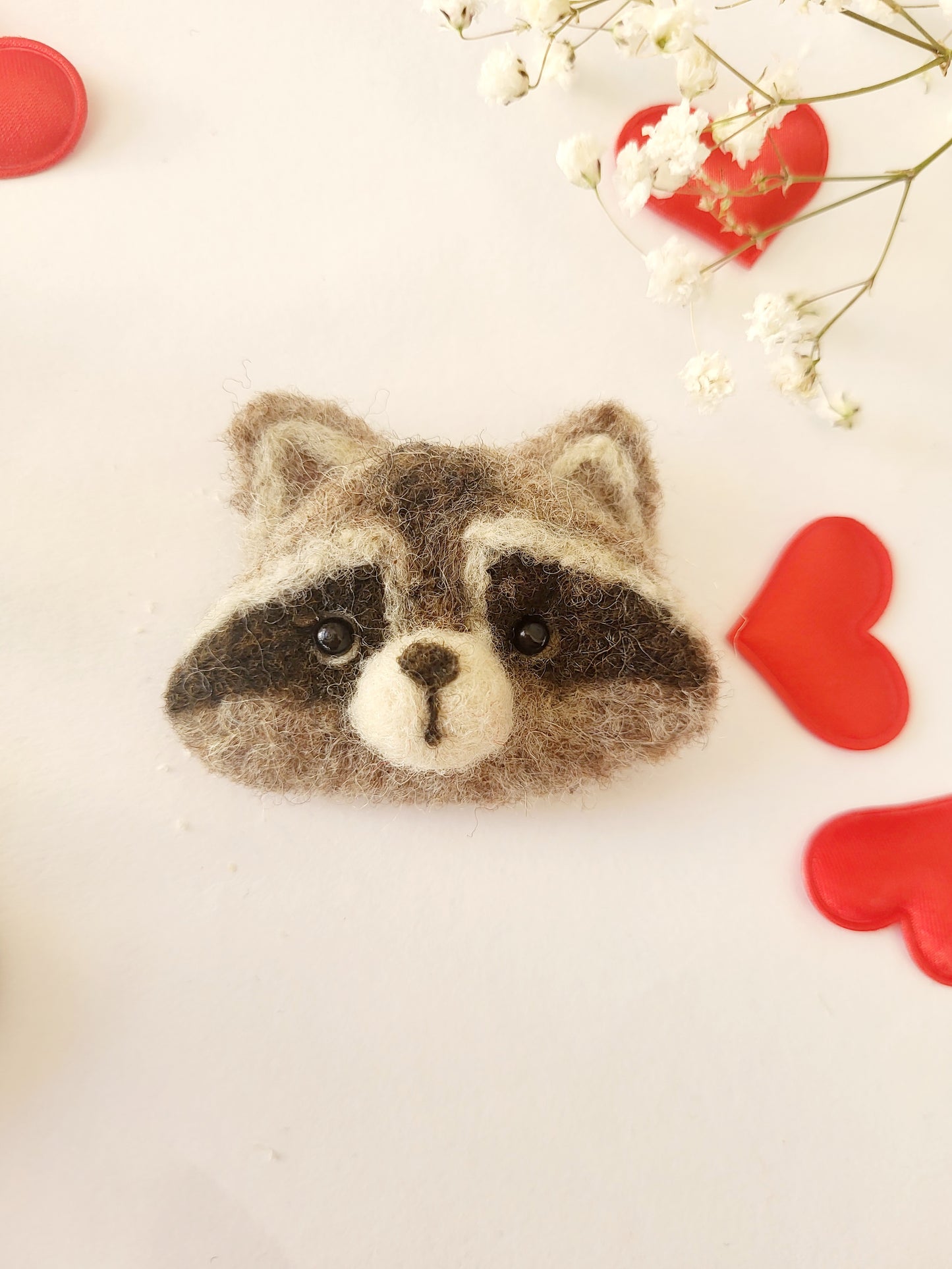 Broșă cap de raton