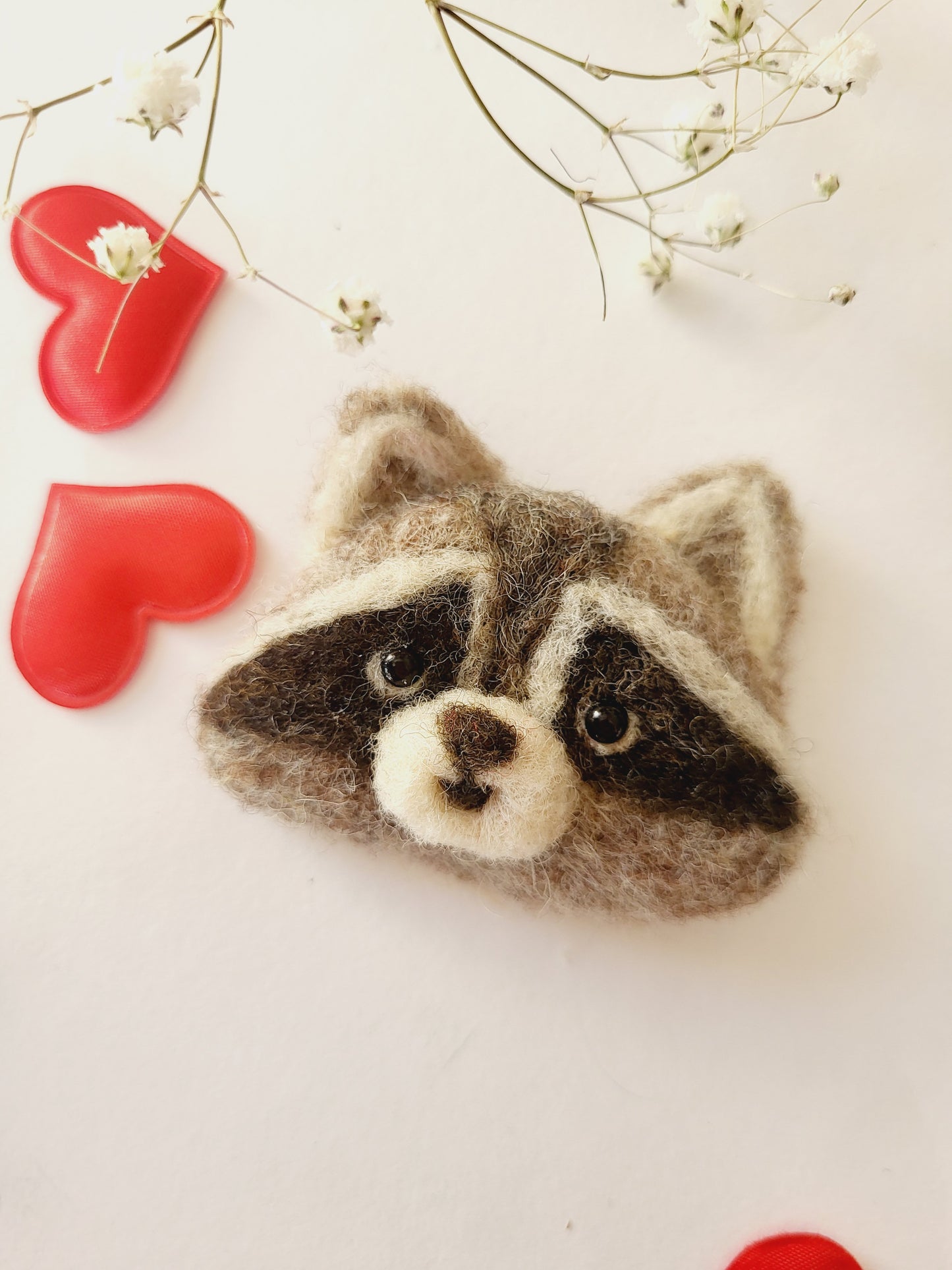 Broșă cap de raton